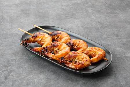Udang Bakar Madu, Grilled Shrimp with honey, made from shrimp seasoned with chilli sauce, pepper and honeyの写真素材