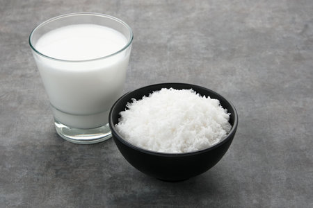 Grated coconut (kelapa parut) on bowl, food preparationの写真素材