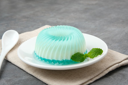 Silky sweet lychee pudding with mint leaves.の写真素材