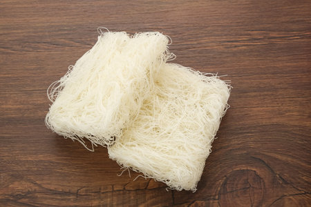 Vermicelli or Dry Glass Noodles on wooden table