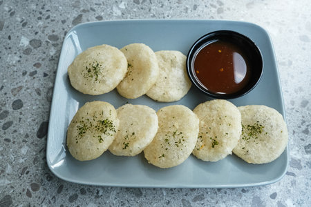 Cireng, a savory snack from West Java, Indonesia, made from tapioca flour and deep-fried, served with a spicy sauce.の写真素材