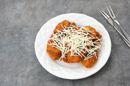 Pisang Goreng Krispi or crispy banana fritters with chocolate and grated cheese. Indonesian foodの写真素材