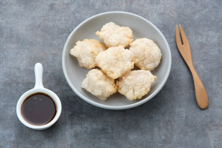 Cireng, a savory snack from West Java, Indonesia, made from tapioca flour and deep-fried, served with a spicy sauce.の写真素材