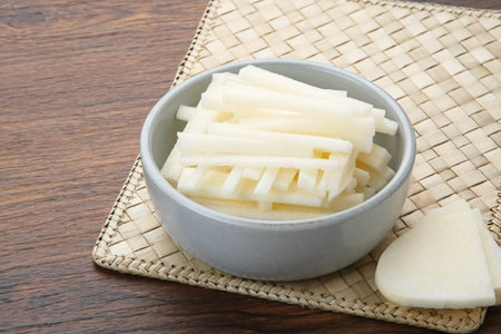 A bowl of fresh jicama or bengkoang (Jicama slices), gut health.の写真素材