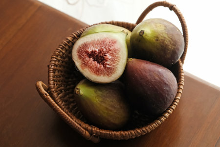 A few figs in a rattan basket. Selected focus imageの写真素材