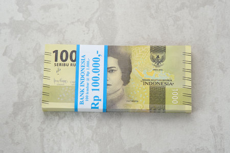 Indonesian currency, thousand (1000) rupiah isolated on the table.のeditorial素材