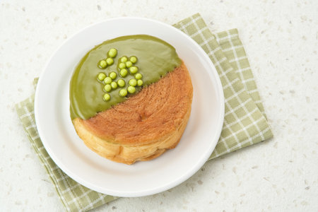 Cromboloni or Crombolini, croissant bomboloni pastry filling with chocolate pasteの写真素材