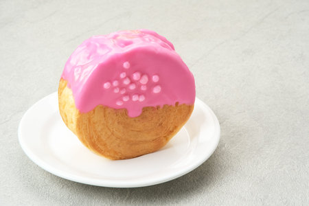 Cromboloni or Crombolini, croissant bomboloni pastry filling with chocolate paste