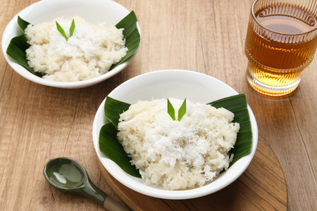 Ketan Kelapa Parut, Indonesian traditional snack, made from steamed glutinous rice and served with grated coconutの写真素材