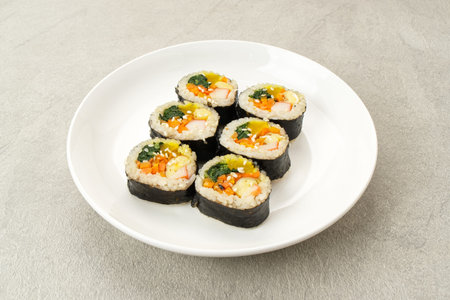 Korean Rolled Gimbap, made of rice, cucumber, tuna, carrot, sausage, crab stick and wrapped with...