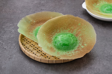 Kue Ape or Serabi Jakarta, made from rice flour with pandan leaf, Indonesian foodの写真素材