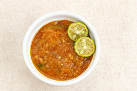 Sambel or Sambal Tomat, made from tomatoes, chilies, salt, sugar, garlic, shallots and shrimp paste (terasi). Indonesian food.の写真素材