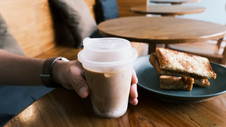 Man holding coffee cupの写真素材