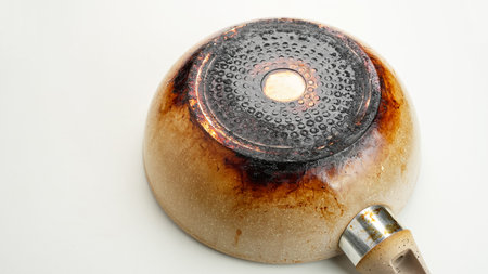 Dirty, oily and burnt teflon frying panの写真素材