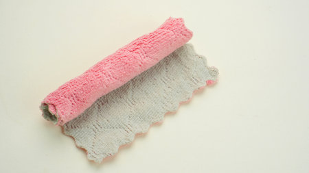 Clean pink microfiber cloth isolated on white, top viewの写真素材