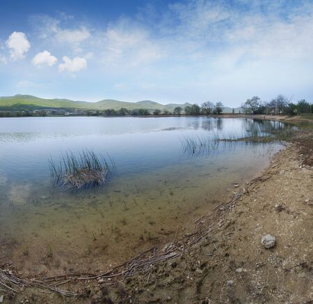 Coast of small lake の写真素材