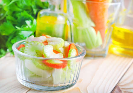fresh salad with carrot and celery, salad in glass bowlの写真素材