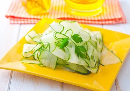 Fresh salad with fresh cucumber and parsleyの写真素材