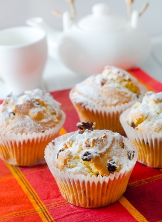 Sweet Muffins with tea on the tableの写真素材