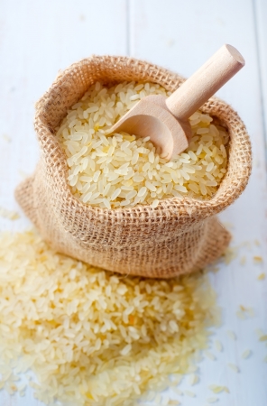 Raw rice on the table, portion of the raw riceの写真素材