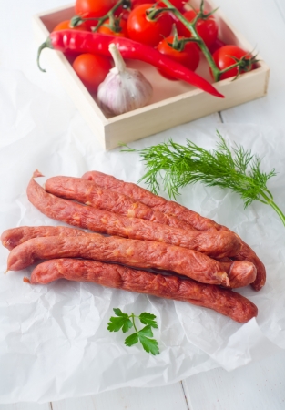 sausages in paper, vegetables in the boxの写真素材