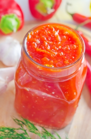 Fresh chilli sauce in the glass bankの写真素材