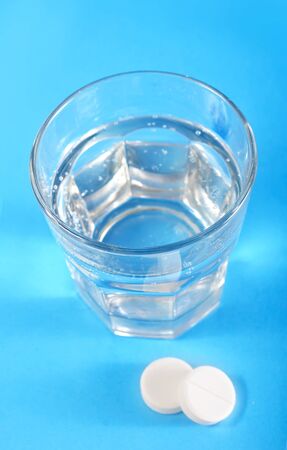 white pills and waterの写真素材