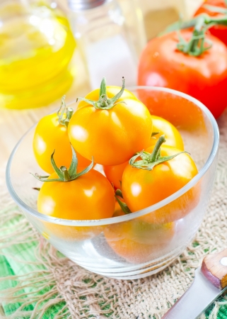 yellow tomato in the glass bowlの写真素材