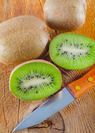 fresh kiwi on the wooden boardの写真素材