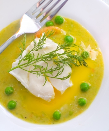 Fresh soup from green peas and egg-poachedの写真素材