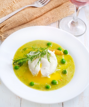 Fresh soup from green peas and egg-poachedの写真素材