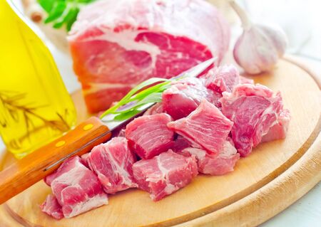 raw meat and knife on the wooden boardの写真素材