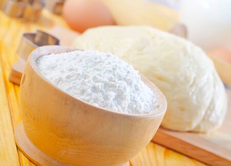 Flour in the wooden bowlの写真素材