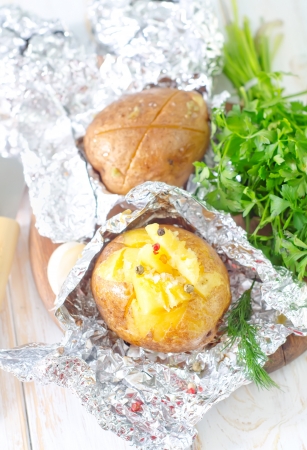 baked potato in foilの写真素材