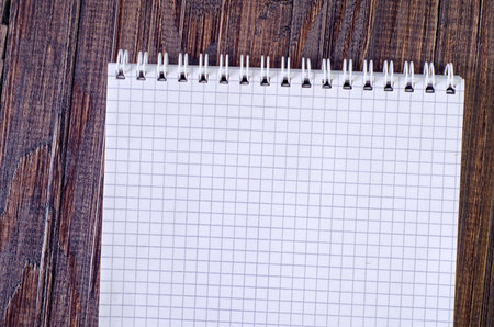 note on wooden background