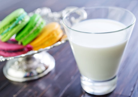 milk in glass and color macaroonsの写真素材