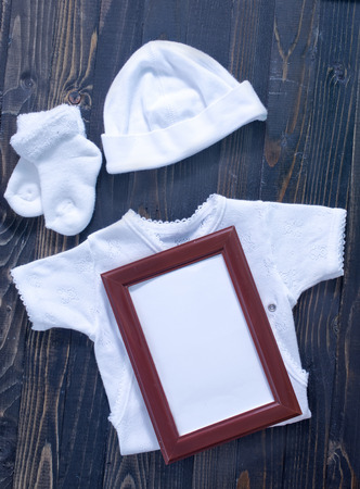 baby clothes on a tableの写真素材