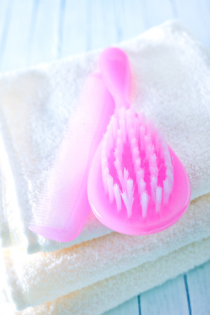 hairs brushes and baby clothesの写真素材