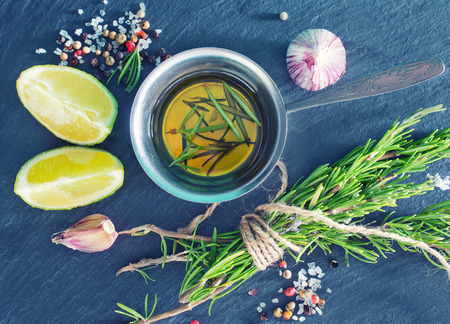 aroma spice, rosemary and olive oil in metal bowlの写真素材