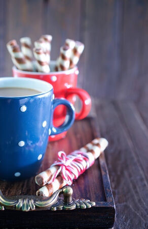 hot cocoa drink in cup and on a tableの写真素材