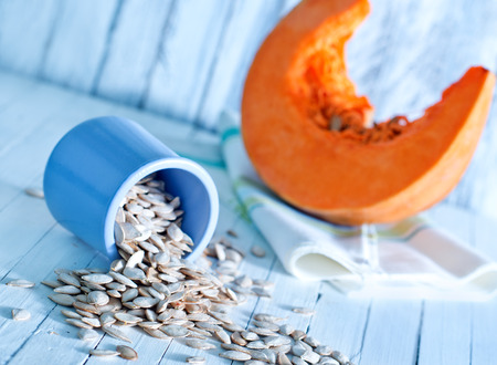 pampkin seed and pumpkin on a tableの写真素材