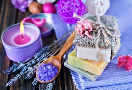 sea salt and soap on the wooden tableの写真素材