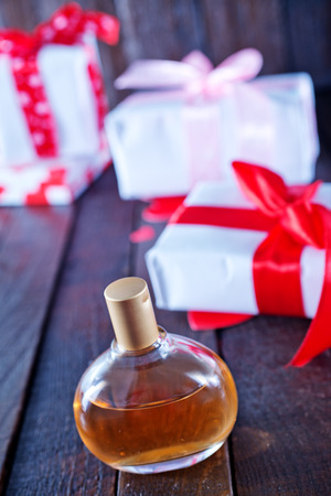 perfume in bottle and on the wooden tableの写真素材