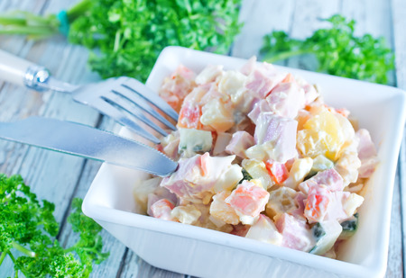 salad in bowl and on a tableの写真素材