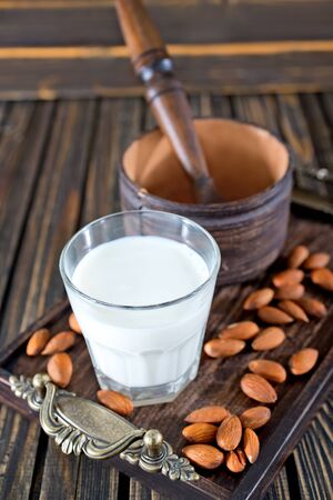 almond milk in glasses and on a tableの写真素材