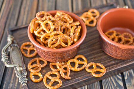 pretzels in bowl and on a tableの写真素材