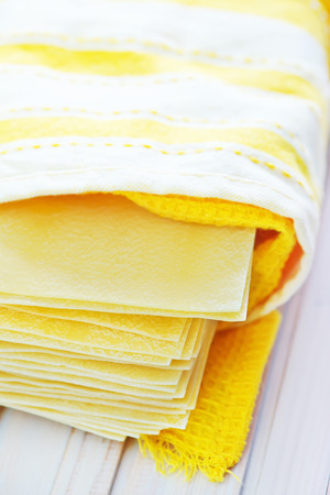 raw dough for lasagna on the wooden tableの写真素材