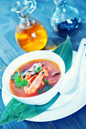 fresh asian soup in bowl and on a tableの写真素材