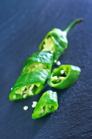 green chilli peppers on the black tableの写真素材