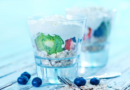 helthy breakfast, oat flakes with cream and fruitの写真素材